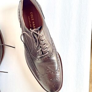 Cole Haan men’s brown Oxford dress shoes.